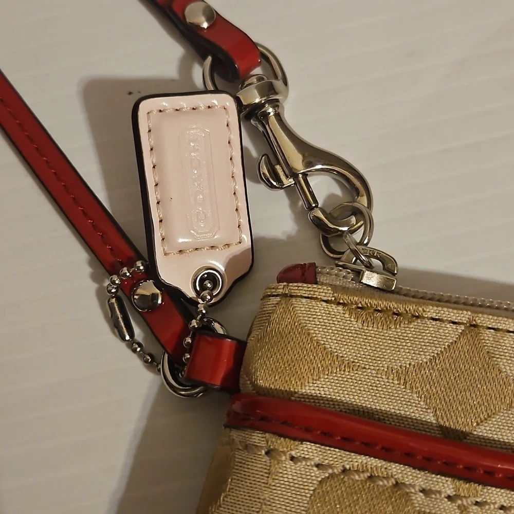 New Coach cream and pink wristlet